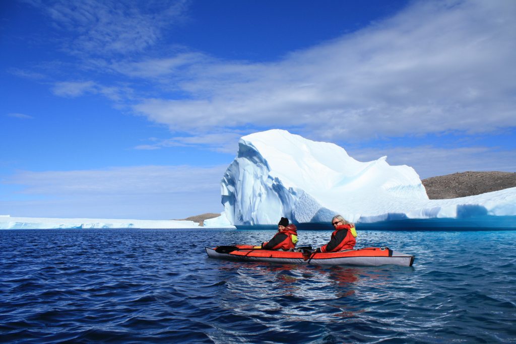 Kayaking by the icebergs in Nunavut