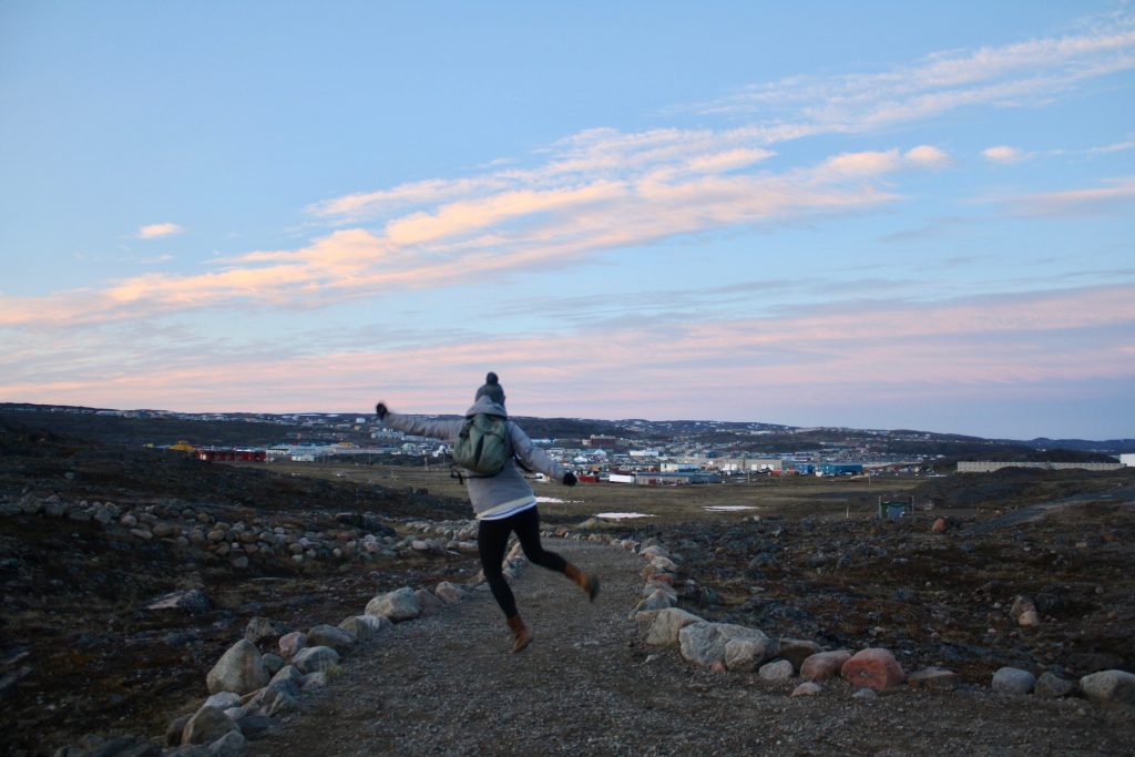 Jumping in front of Iqaluit houses