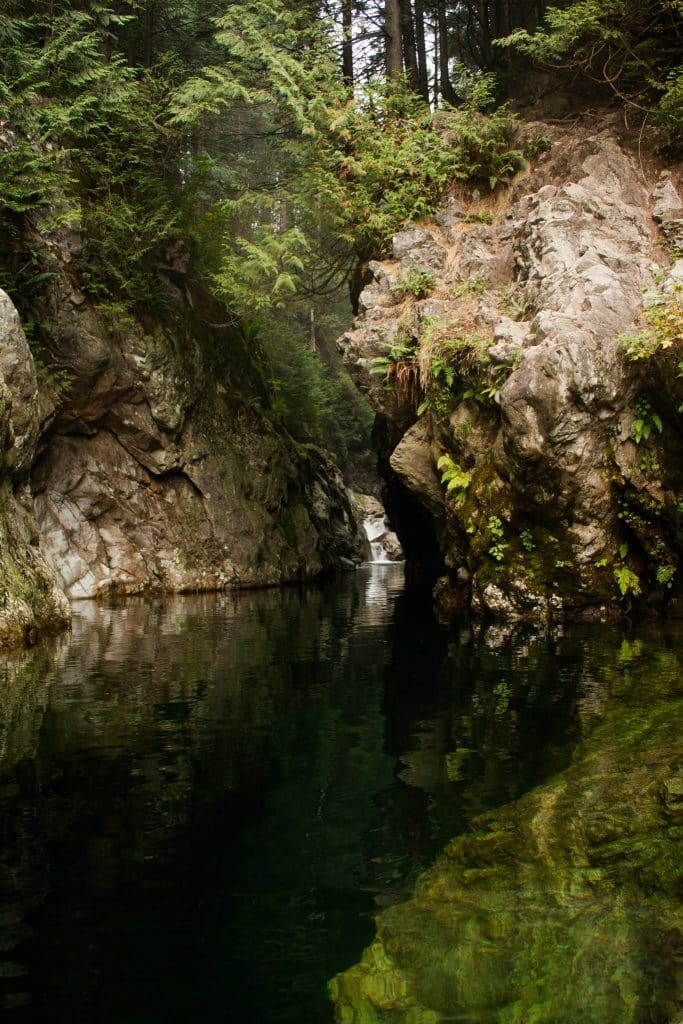 Rocks reflected in the water at Lynn Canyon