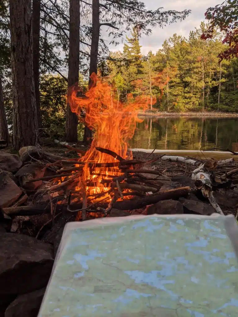 Deciding routes near campfire at Killarney provincial park