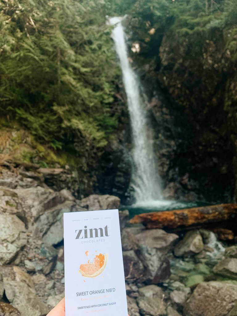 Zimt Chocolate Bar in front of Norvan Falls. Zimt has lots of gluten free options in Vancouver.