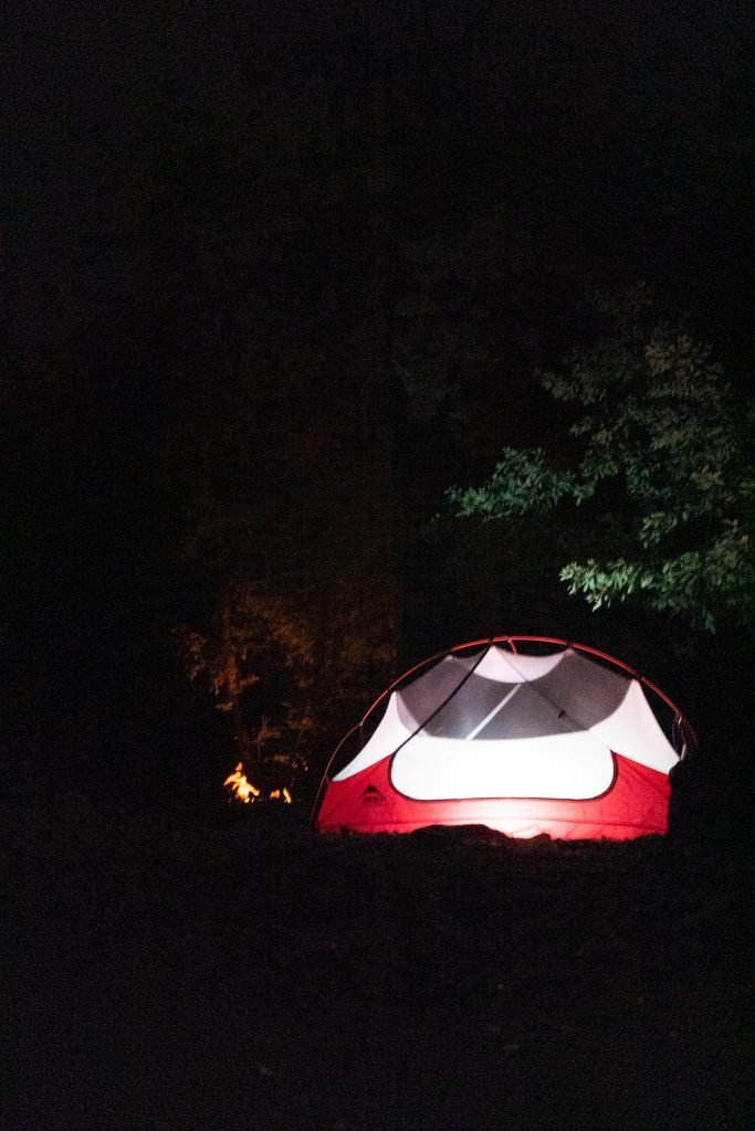 Tent illuminated at night at Sykes Hot Springs