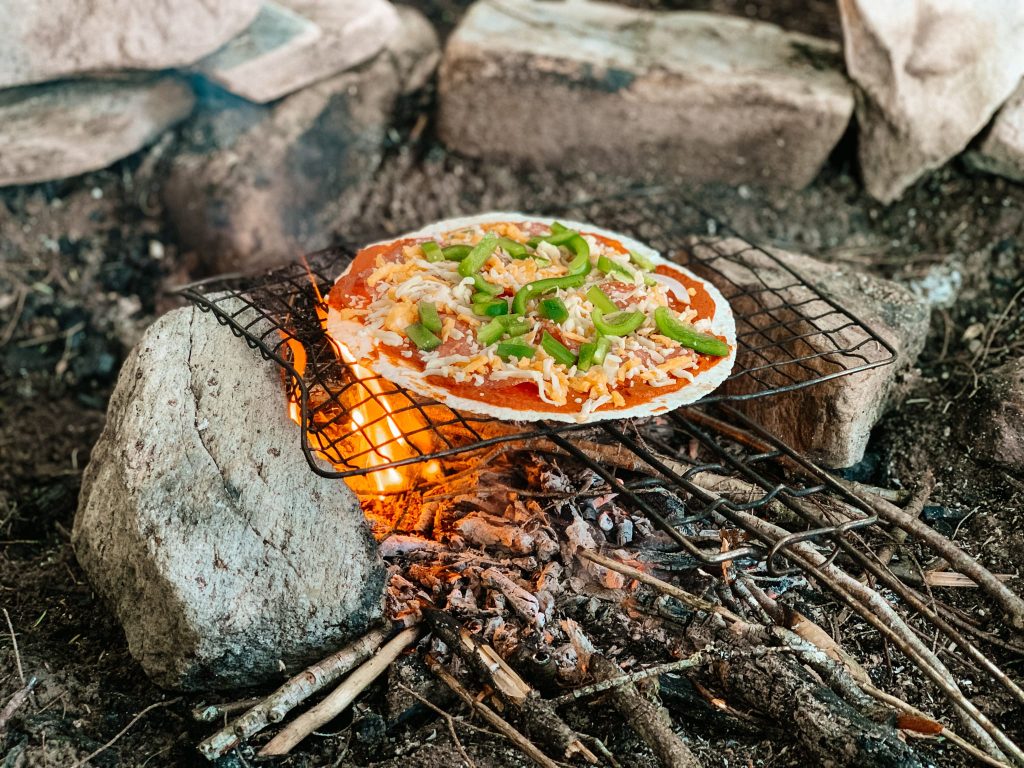 Pizza cooked over a fire in Algonquin Provincial Park