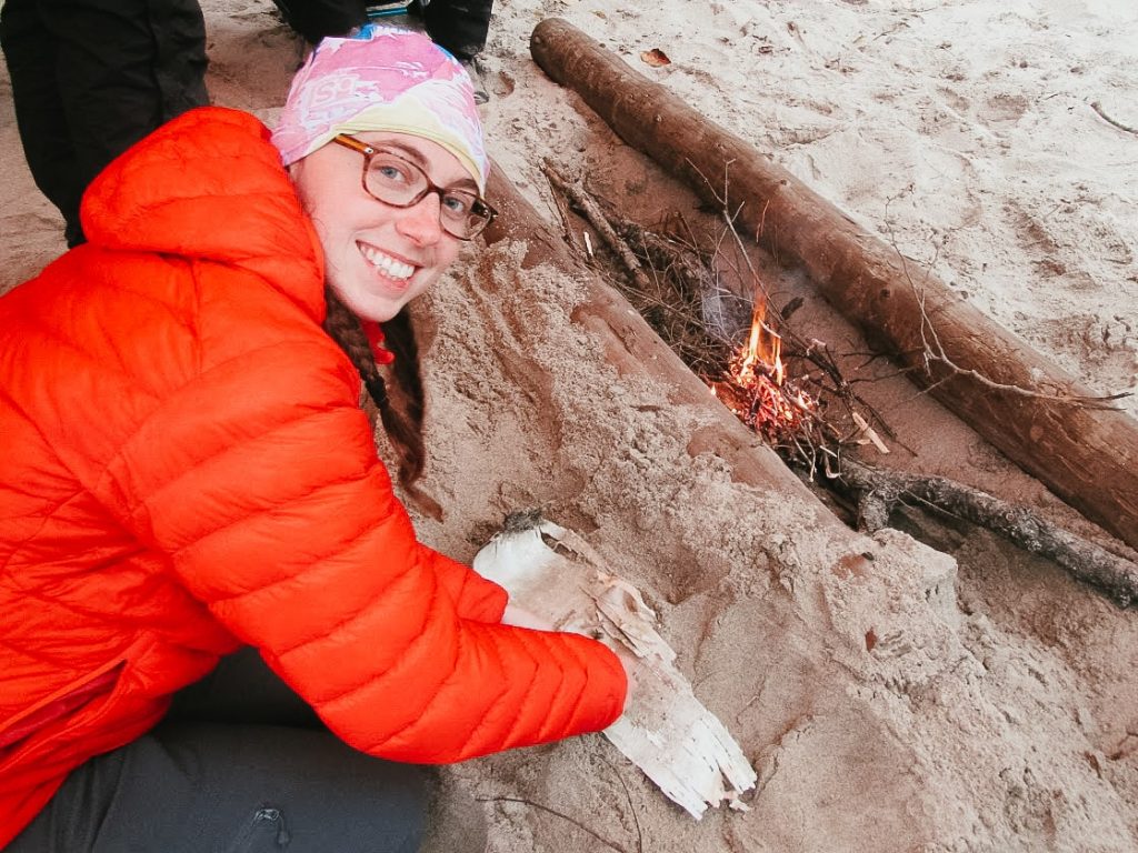 Wearing a puffy jacket and hiking pants as a hiking outfit for women on a chilly day on the coulonge